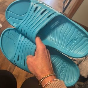 Blue size 11 men’s Hoka slides. New without tags.